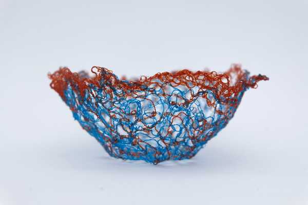 A delicate thread bowl made with water soluble fabric