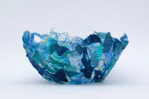 A blue thread bowl made using water soluble fabric